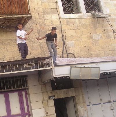 Boys removing metal windows